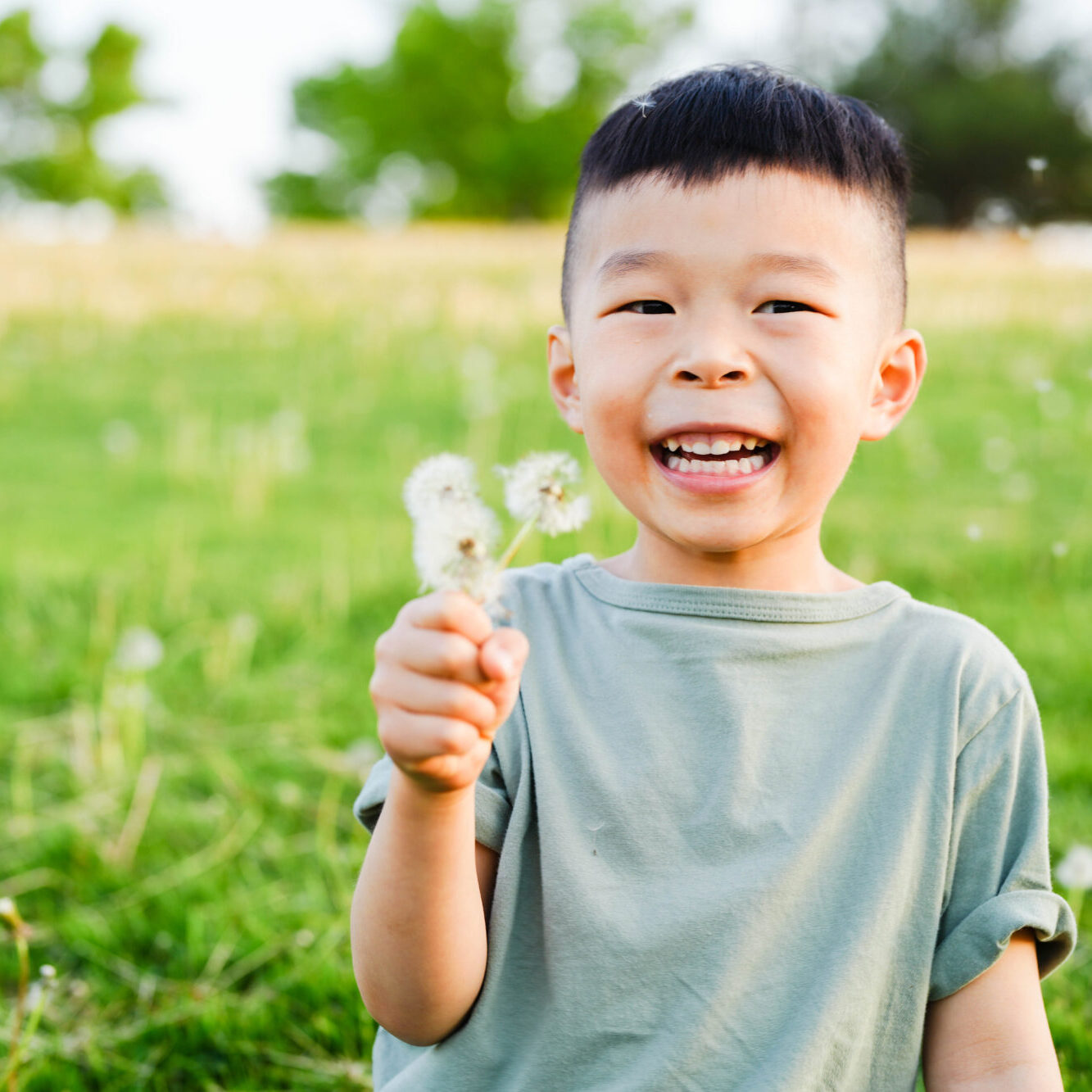 A blissfully happy boy laughing because his mother used our paperless new patient forms to skip the waiting room lines